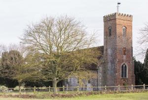 A picture of St Peter's Carlton with the tower to the fore